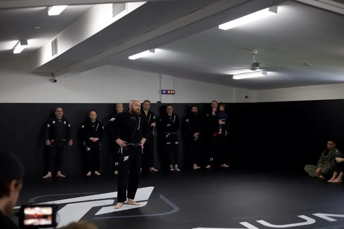 Head coach Jason Powell with the Platinum Jiu Jitsu coaching team on the mats in Oxenford